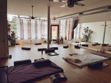 a picture of our yoga room where we offer trainings, workshops, yoga classes, sound baths and dance