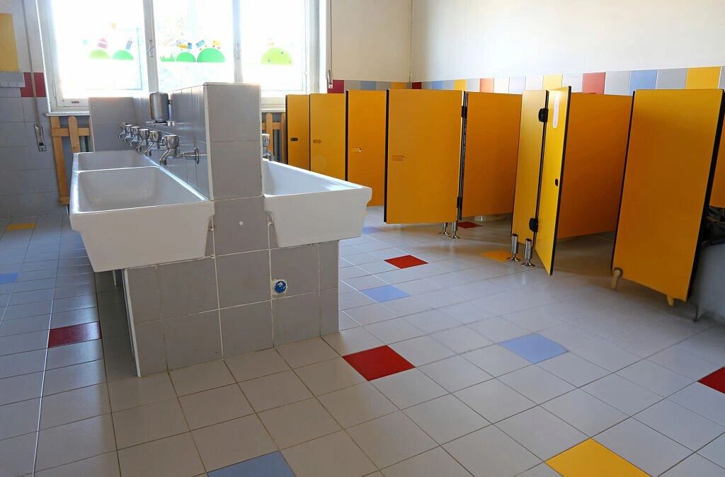 cleaning toilets using best sanitising chemicals, peace of mind for your kids to be at school.