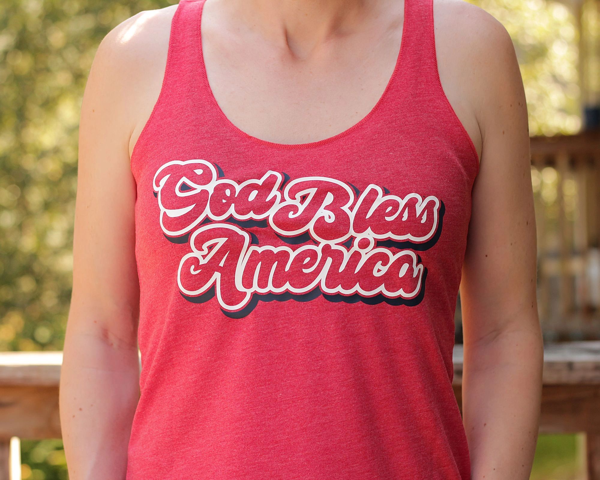 God Bless America on a ladies racerback tank top by Gaffren