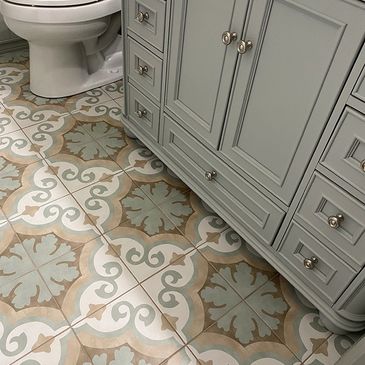 beige and sage green encaustic cement tile on bathroom floor