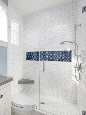 White subway tile shower with blue accent tiles