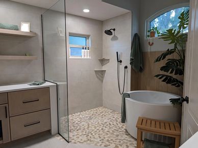 Spa bathroom with pebble shower floor.