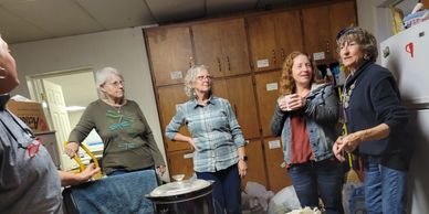 Group of Friends smiling in library kitchen