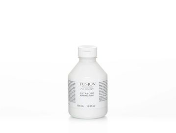 White bottle of Fusion Ultra Grip bonding agent on white background.