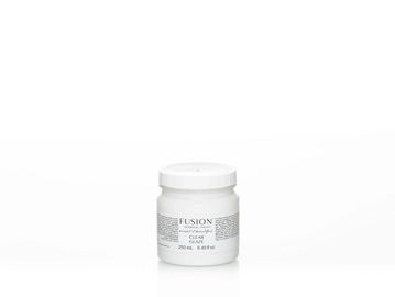 A small white jar of Fusion Clear Gesso paint on a white background.