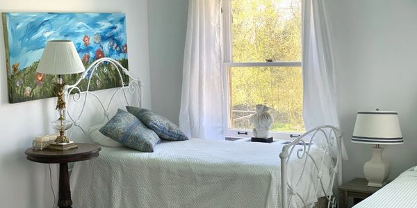 a bedroom with a wall painting