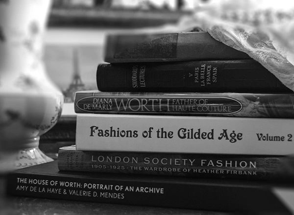 Stack of vintage books and French fashion