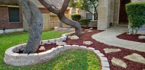 Expanded mulch bed, put down pavers