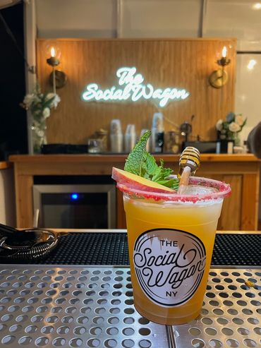 A social wagon mocktail in a decoritve cup with Garnishment
