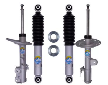Set of four silver and black shock absorbers with two silver rings.