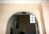 In this kitchen, my client wanted a Tuscan stone wall glaze, complete with scroll detail above foyer archway.
