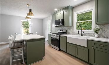 Our group tiled this beautiful backsplash and completed the drywall in this house flip.