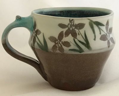 Stoneware mugs fired to cone 6 with original hand painted designs. $35.00 
H 3.5" W 4"   5" at handl