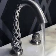 A flowing water tap with a lattice-designed base.