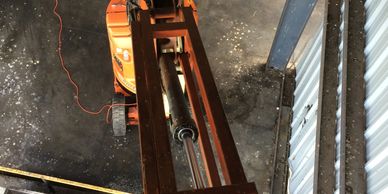 A cherry picker inside a building under maintenance.
