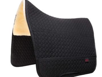 Black quilted saddle pad with fleece lining.