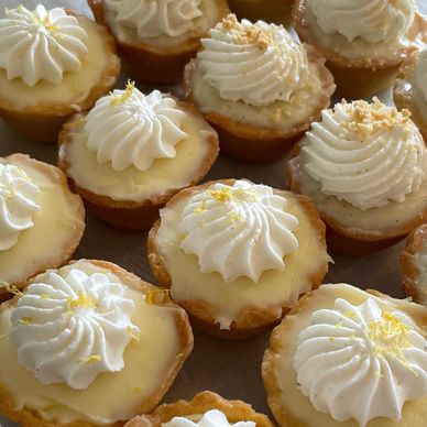 Luscious Lemon Tarts with Whipped Cream and Zesty Lemon Sprinkles and Delicious Vanilla tarts 