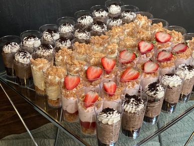 Irresistible Dessert Cup Shooters: Oreo, Strawberry, and Vanilla Cheesecake.