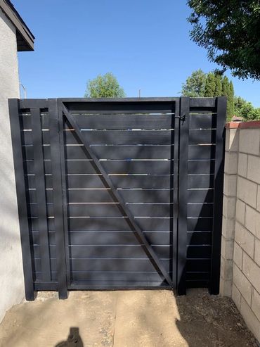 New exterior pressure treated wood and red wood with black eggshell paint to give it a modern look.