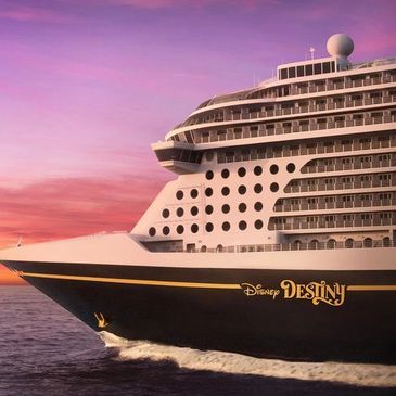 Disney Destiny cruise ship at sunset.