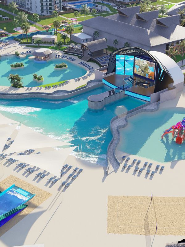 A luxurious resort with multiple pools, sun loungers, and a stage with a large screen.