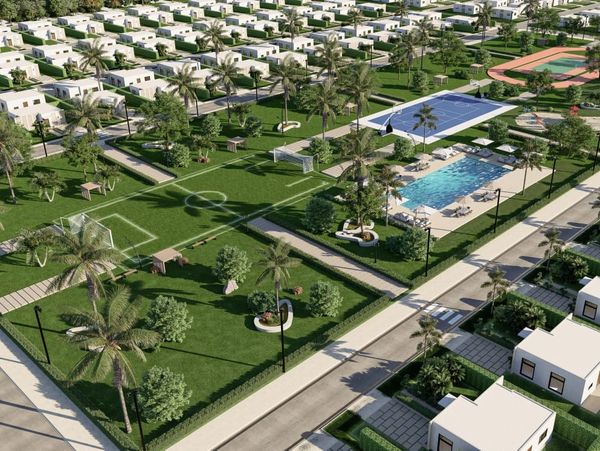 Aerial view of a modern residential community with sports and recreational facilities.