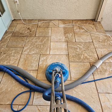 Me cleaning tile outdoor patio