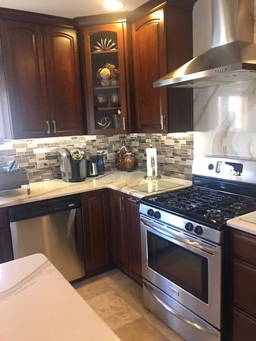 New Cherry wood cabinets installed up to ceiling