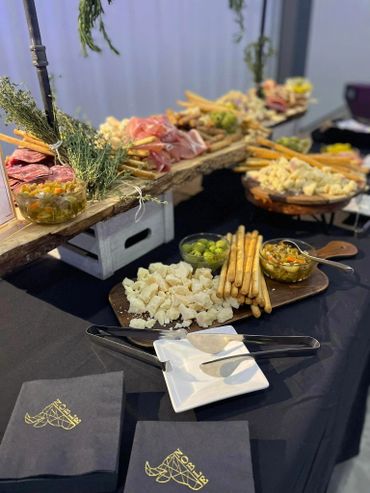 charcuterie board with an assortment of meat and cheeses for a fun social event in milwaukee