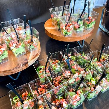 Display of salads in a cup for a corporate event