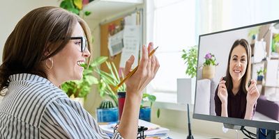 Two women on a one-to-one conversation via Zoom video interface.