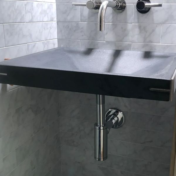 Modern powder room sink with wall mount faucet