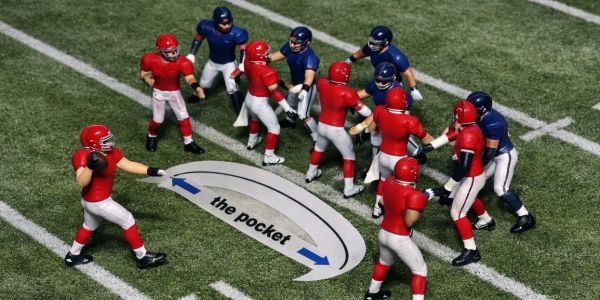 Miniature football players demonstrating the concept of "the pocket."