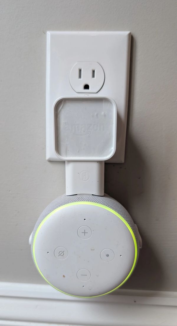 A voice control smart speaker neatly mounted on an outlet