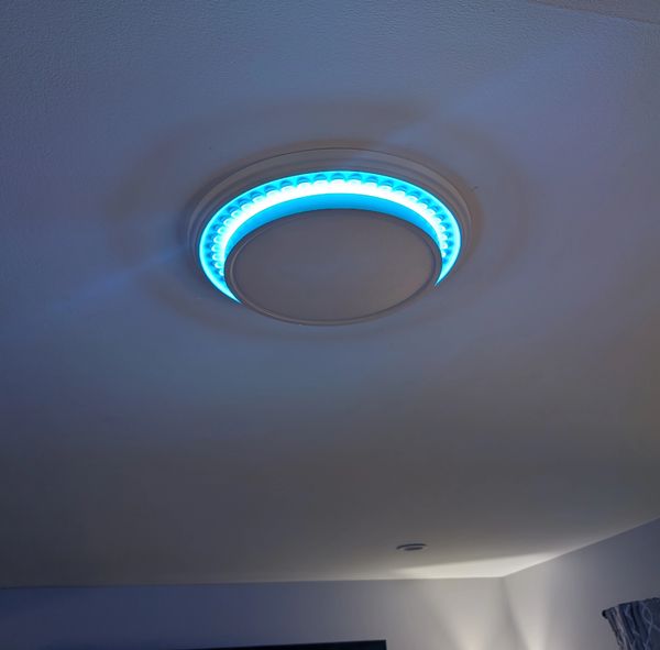 Low profile ceiling fixture set to cyan