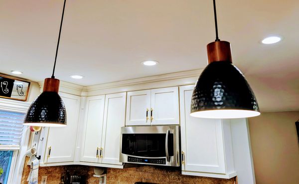 Smart recessed lights and island pendants. Effortless control of color and brightness at any time of