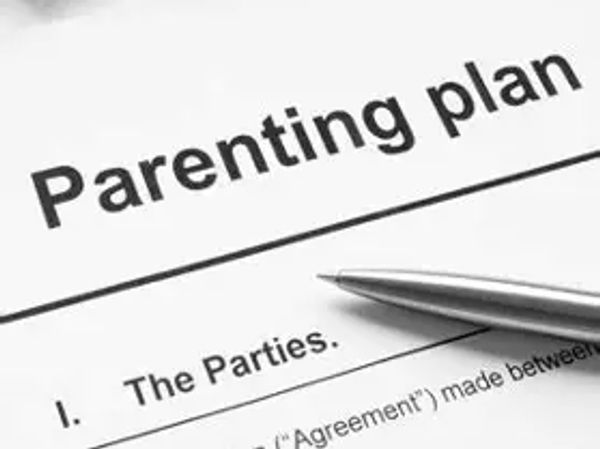 Parenting plan document with a pen.