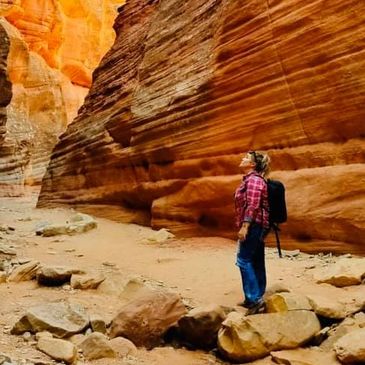 photographer in desert canyon