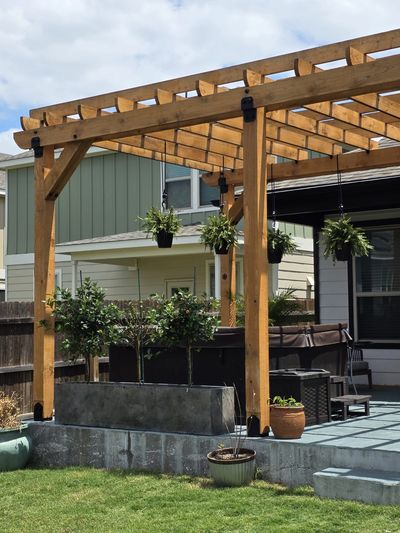 Custom pergola with electrical lighting by Raptor Electric & General Contractor in Austin,TX.