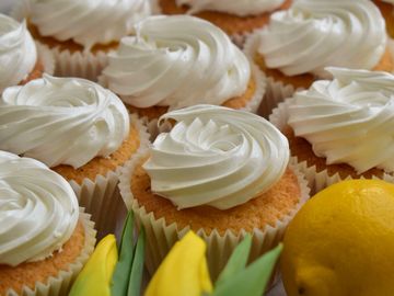 bio organic lemon cupcakes filled with lemon curd and meringue frosting