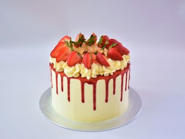 custom bio mascarpone and strawberry cake with homemade strawberry coulis and strawberries