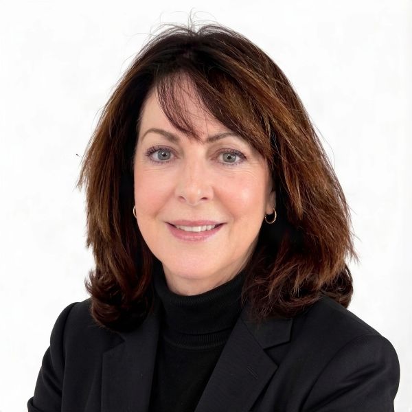 Professional woman with brown hair in black attire.