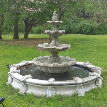 A gorgeous tiered concrete garden fountain!