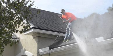 Professionals pressure washing your house