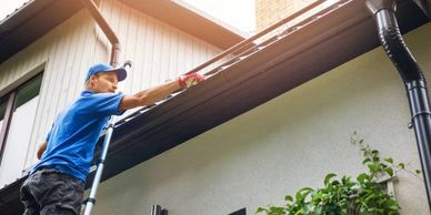 Professionals cleaning your gutters