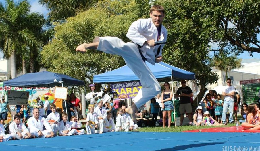 Martial artist jumping side kick