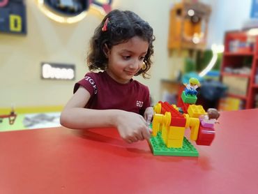 Academy student learning Duplo