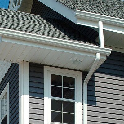 White gutters with white trim on gray two-story house