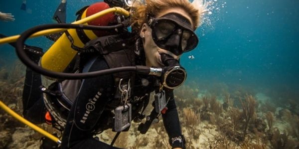Crew member Kay diving on a dive site