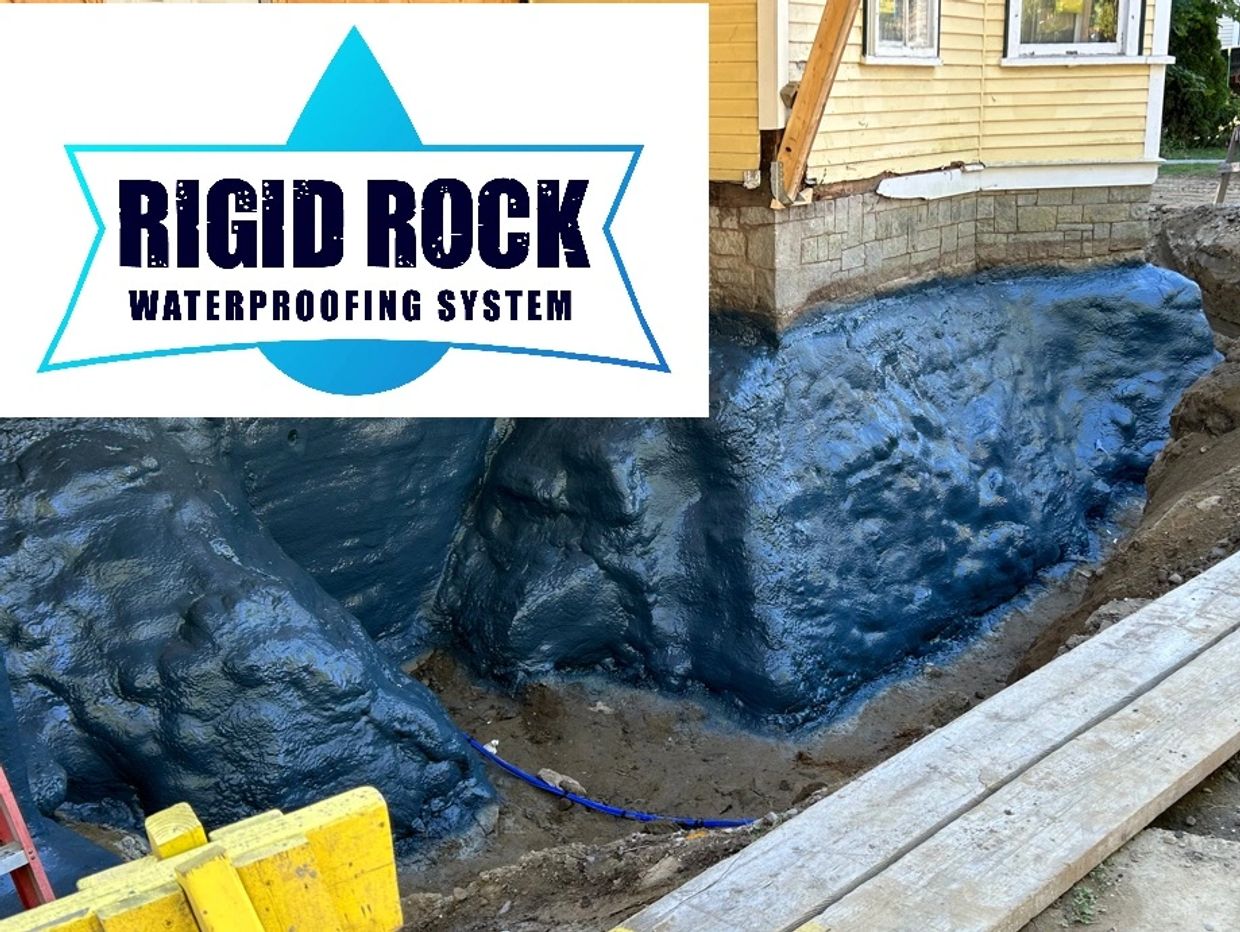 Foundation coated with Rigid Rock waterproofing system for protection.